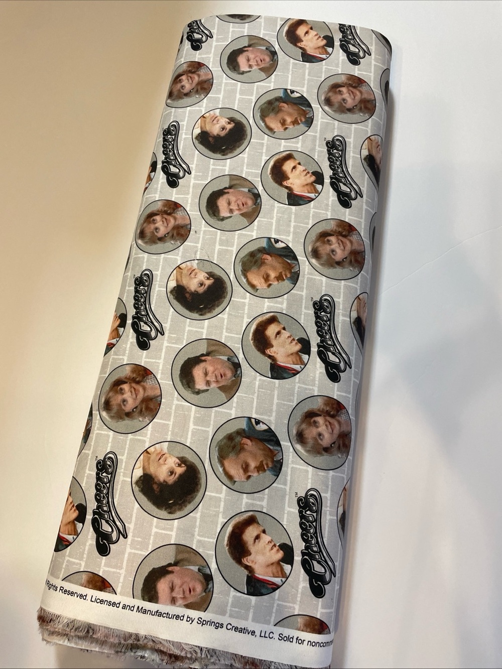 CHEERS Photo Reel Badges FABRIC. Featuring the cast. Gray. Brick. 7 Yards